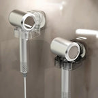 Minimalist wall-mounted holders with modern silver hair dryers in a bathroom setting