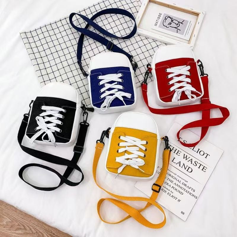 Trainer shape canvas crossbody bag in black, blue, red and yellow