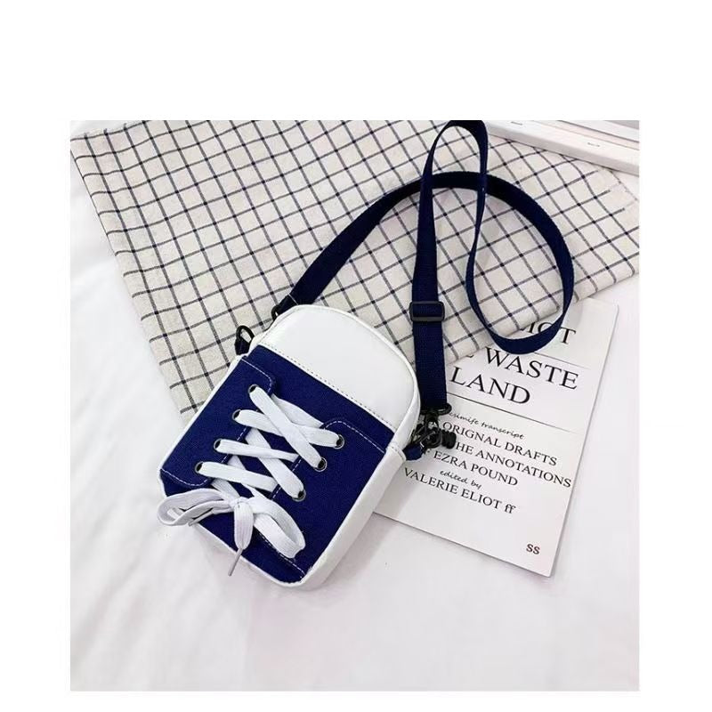 Blue trainer shape canvas crossbody bag with white laces