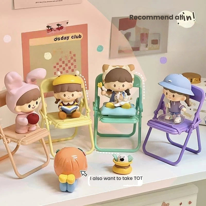 Cute Korean-style figurines in pastel outfits on mini chairs, modern room decor accessories