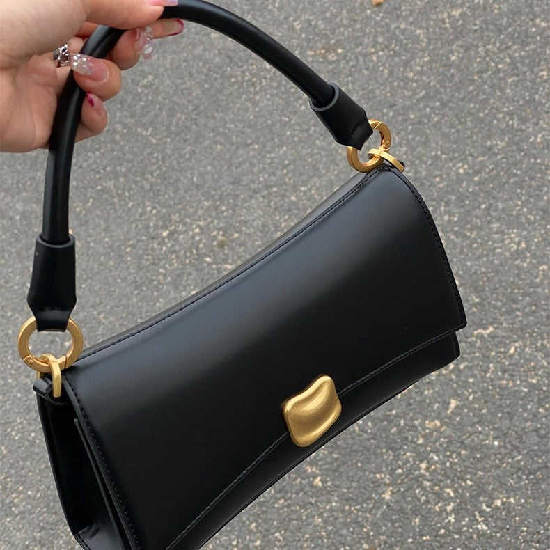 Sculptural Clasp Baguette Bag