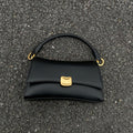 Sculptural Clasp Baguette Bag