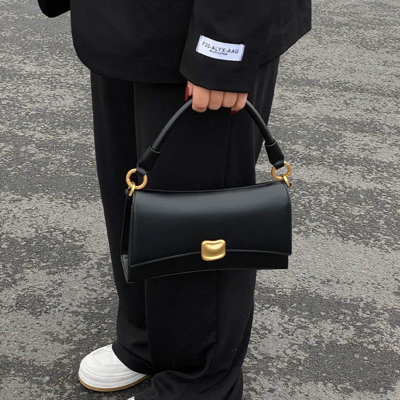 Sculptural Clasp Baguette Bag