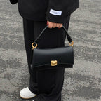 Sculptural Clasp Baguette Bag