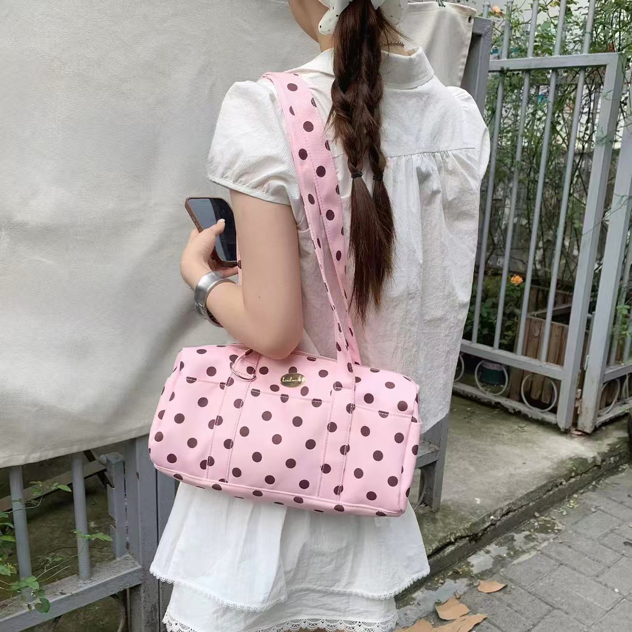 Pink White Dot polka dot boston bag worn on the shoulder