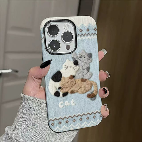 Sleeping cats knitted-look phone case held in the hand